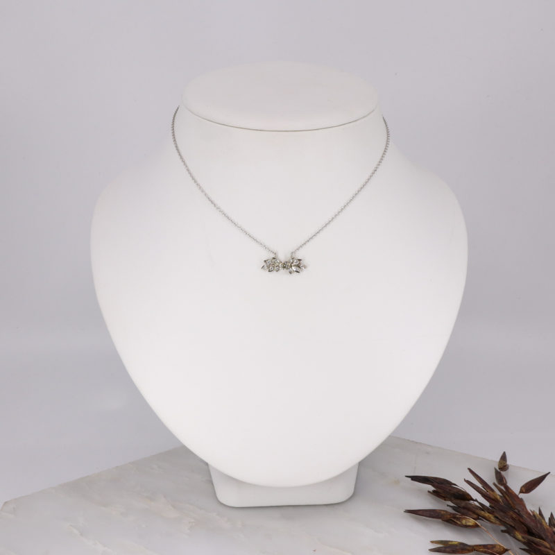 18ct white gold rose and thorn pendant with central white diamond